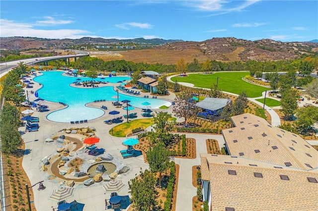 birds eye view of property with a mountain view