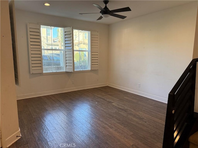 unfurnished room with ceiling fan and dark hardwood / wood-style floors