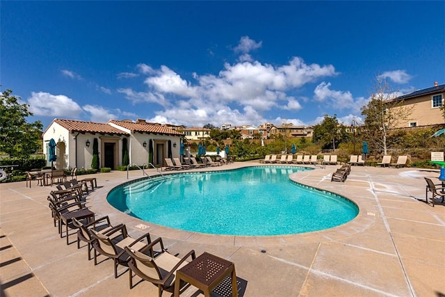 view of swimming pool featuring a patio area