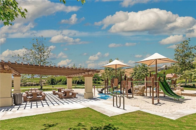 view of play area featuring a yard and a pergola