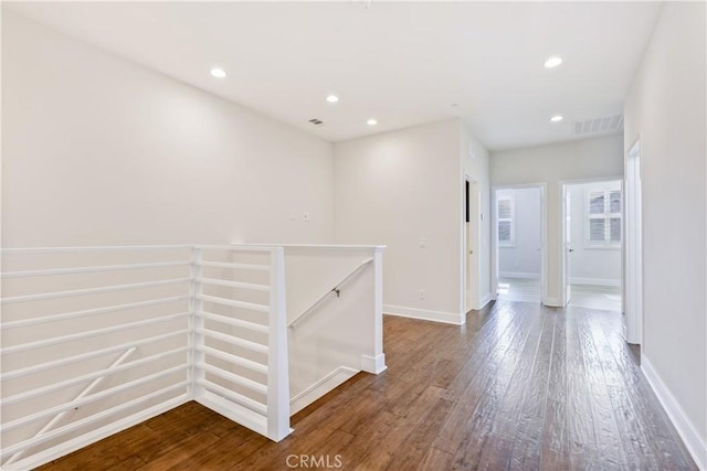 corridor featuring hardwood / wood-style flooring