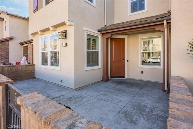 doorway to property featuring a patio area