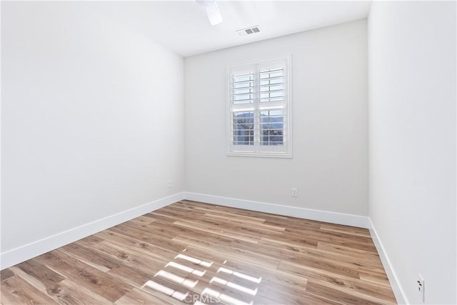 spare room with light hardwood / wood-style floors