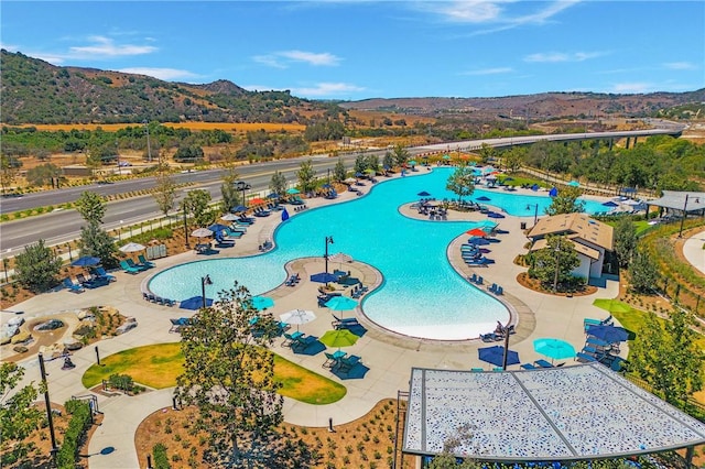 view of swimming pool featuring a mountain view