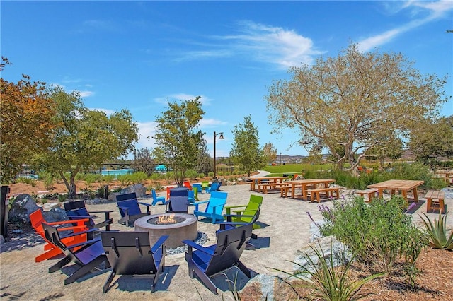 view of patio / terrace featuring an outdoor fire pit