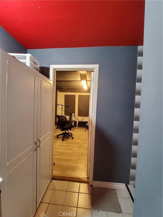 hallway with light hardwood / wood-style flooring