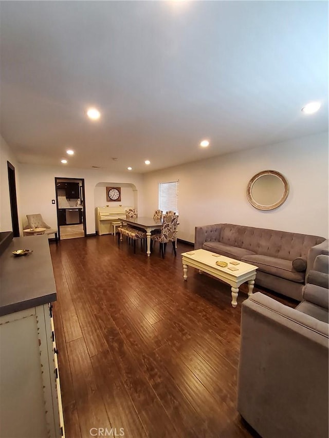 living room with dark hardwood / wood-style flooring