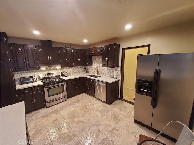 kitchen with backsplash, stainless steel appliances, dark brown cabinetry, and sink