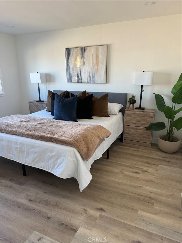 bedroom featuring hardwood / wood-style flooring