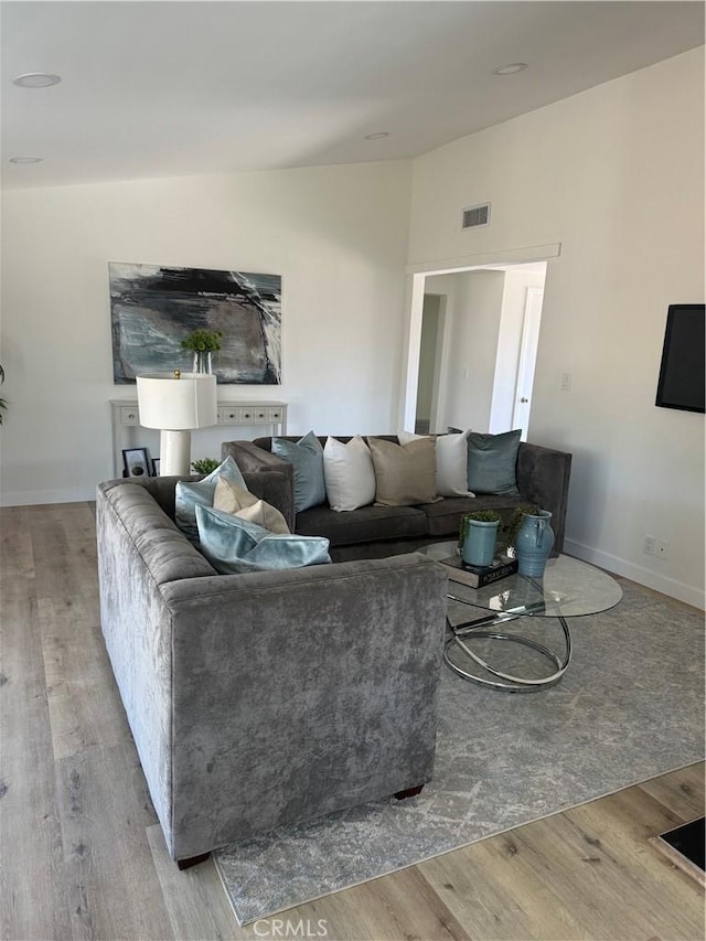 living room with light hardwood / wood-style floors