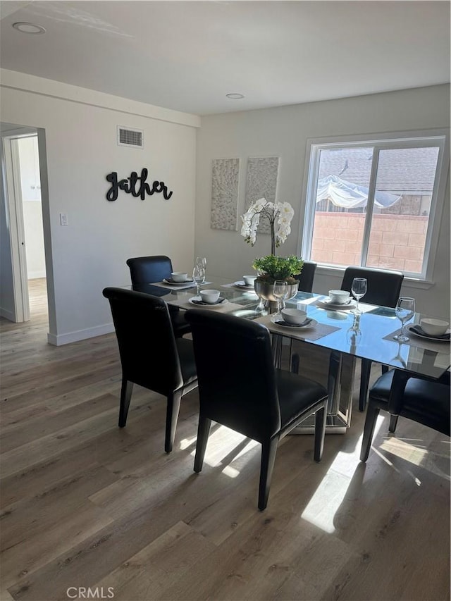 dining room featuring wood-type flooring