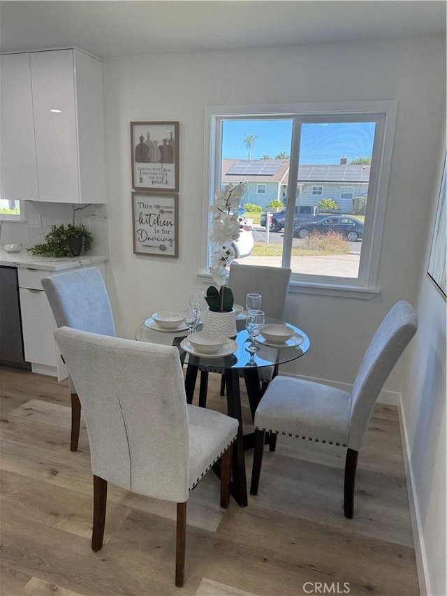 dining area featuring light wood-type flooring