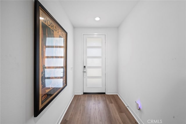 doorway to outside with hardwood / wood-style floors