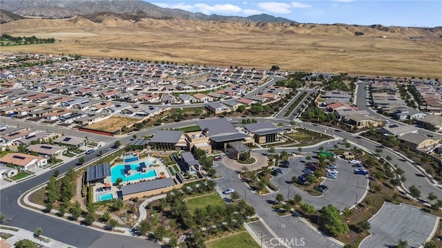 birds eye view of property featuring a mountain view