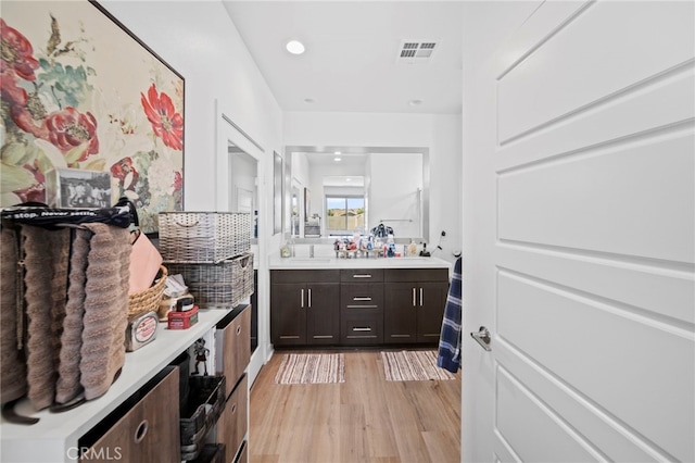 bathroom featuring vanity and hardwood / wood-style flooring