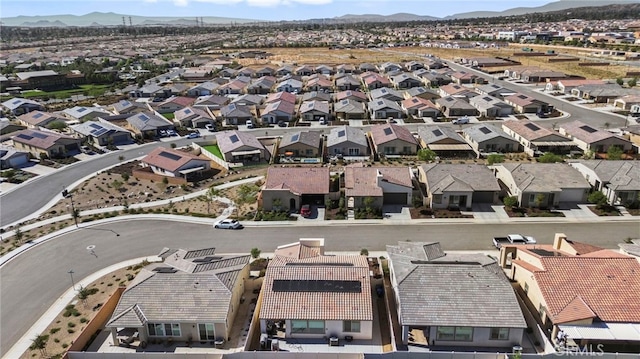 birds eye view of property with a mountain view