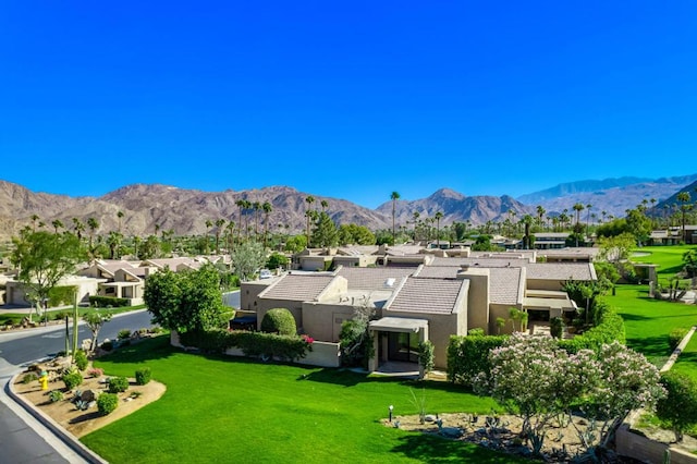 birds eye view of property with a mountain view