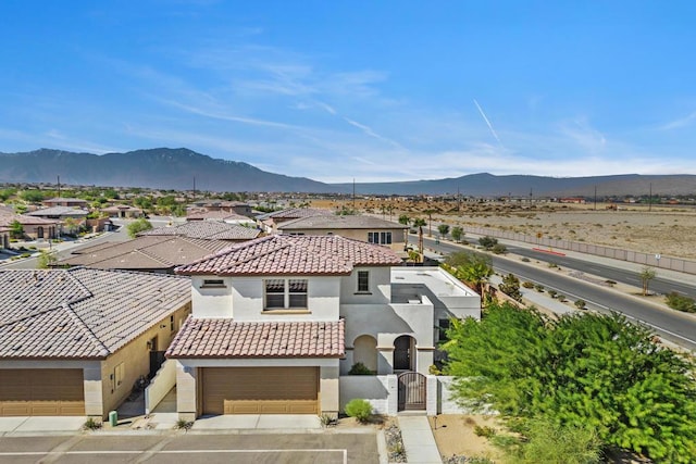 birds eye view of property with a mountain view