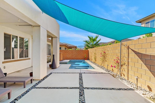 view of patio featuring a fenced in pool