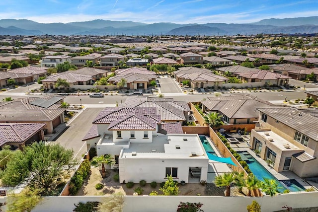 birds eye view of property featuring a mountain view