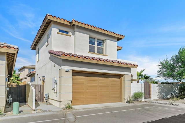 mediterranean / spanish house featuring a garage