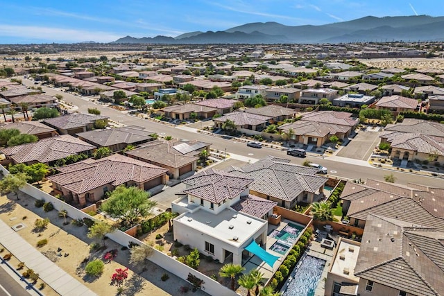 birds eye view of property with a mountain view