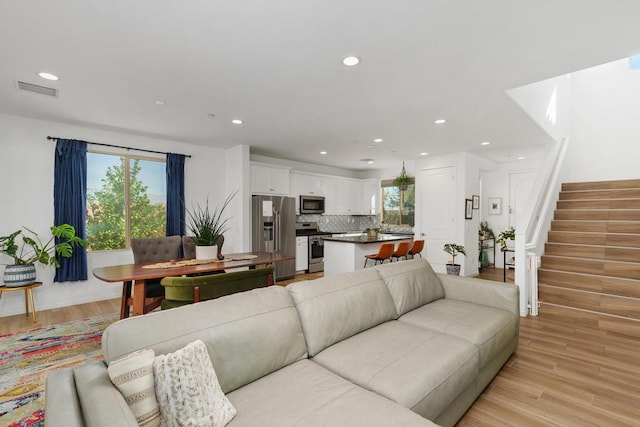 living room with light hardwood / wood-style flooring