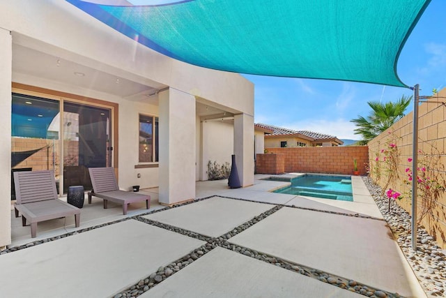 view of patio with a fenced in pool