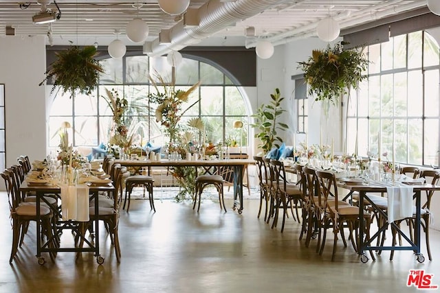 dining space with concrete floors