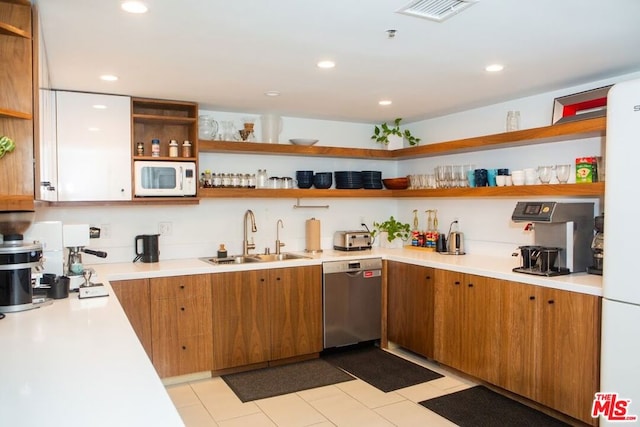 kitchen featuring white appliances and sink