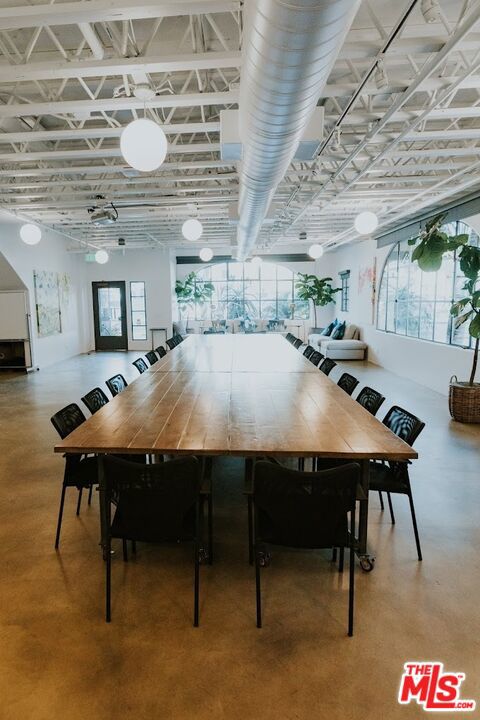 unfurnished dining area with concrete floors