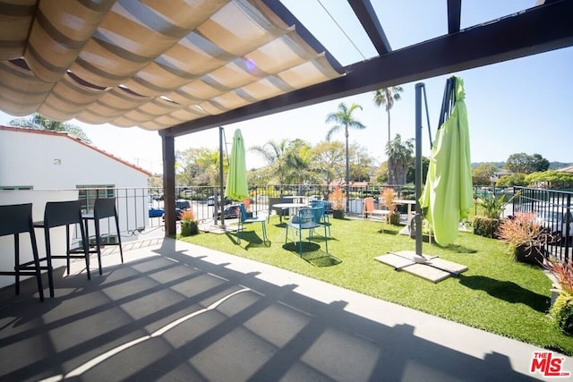 view of patio / terrace featuring a pergola and a bar