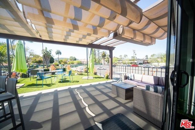 view of patio with outdoor lounge area and a pergola