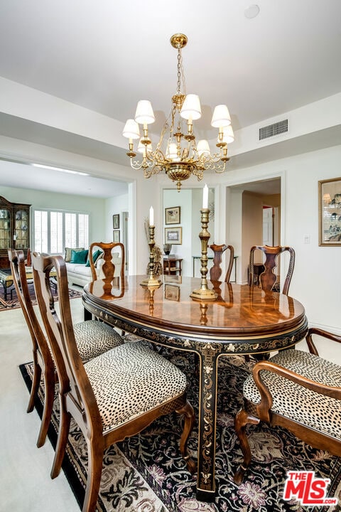 dining area featuring a notable chandelier