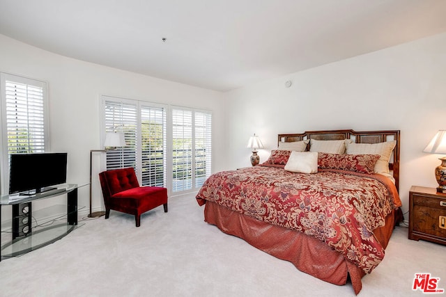 bedroom with light carpet