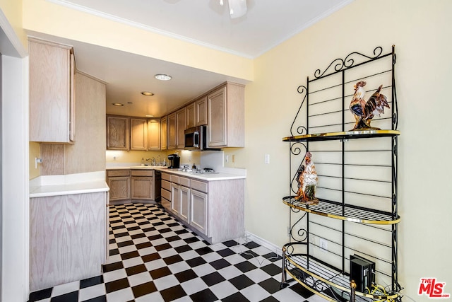 kitchen featuring light brown cabinetry, white gas stovetop, sink, and ornamental molding