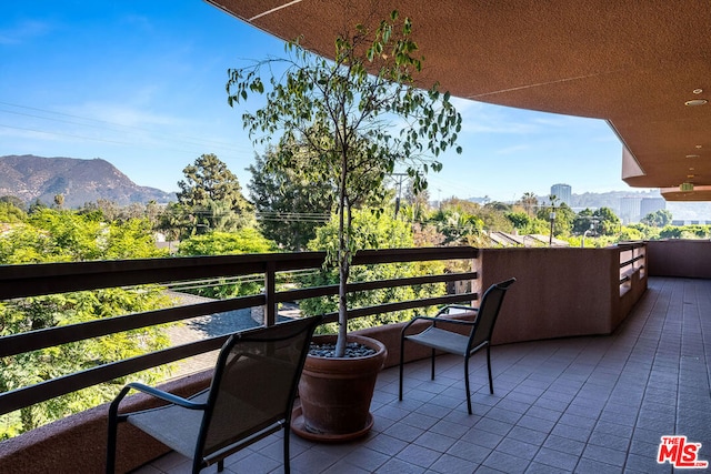 balcony featuring a mountain view