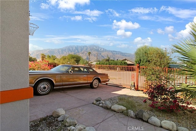 view of parking / parking lot featuring a mountain view