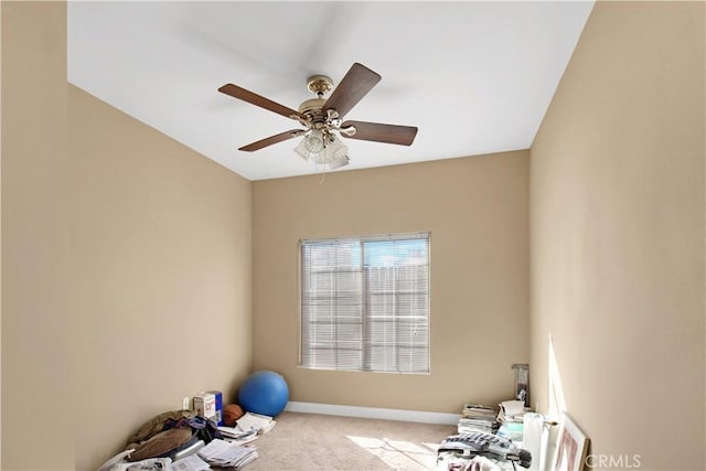 workout room featuring carpet floors and ceiling fan