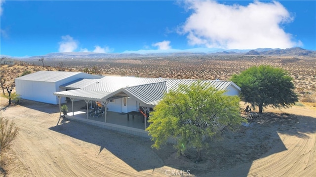 drone / aerial view featuring a mountain view