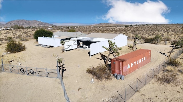 birds eye view of property featuring a mountain view