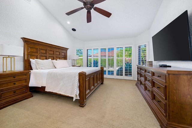 carpeted bedroom with ceiling fan, access to exterior, and high vaulted ceiling