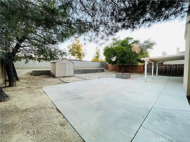 view of patio / terrace featuring a storage shed