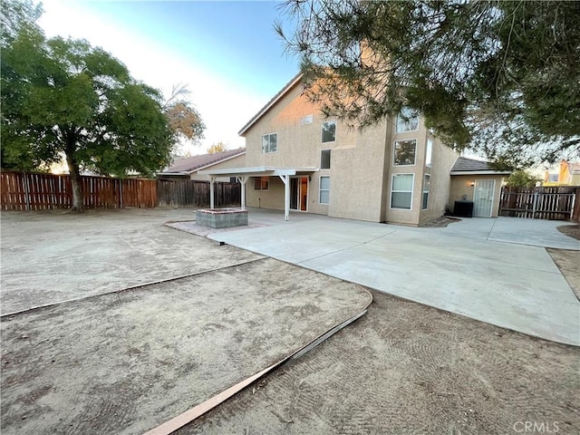 rear view of house featuring a patio area and central air condition unit