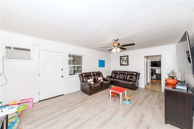 living room with a wall mounted AC, crown molding, light hardwood / wood-style flooring, and ceiling fan