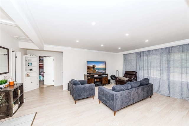 living room featuring crown molding and light wood-type flooring