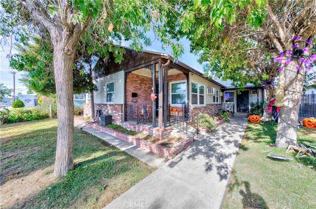 view of front of property with a front lawn and central AC unit