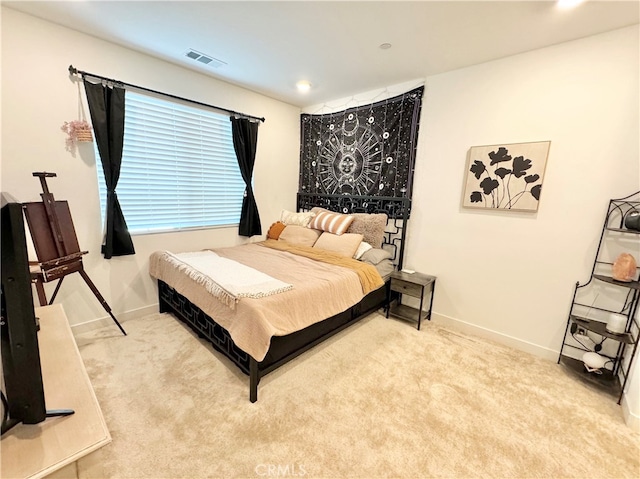 bedroom with light carpet