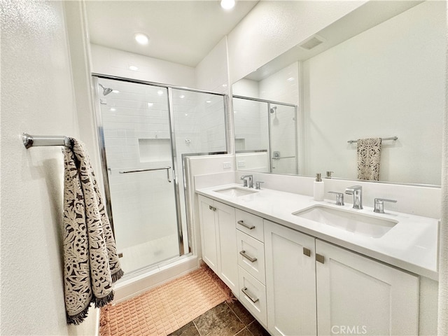 bathroom featuring vanity, walk in shower, and tile patterned floors