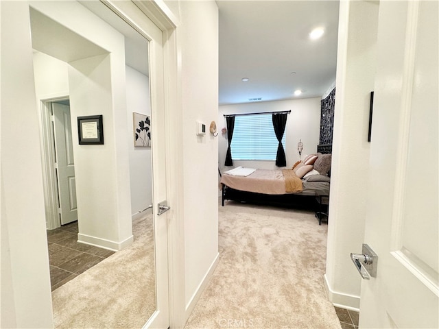 hallway featuring carpet floors